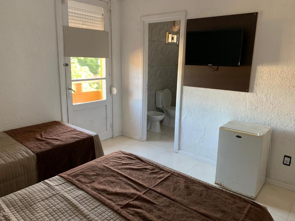 Postel nebo postele na pokoji v ubytování Hotel American