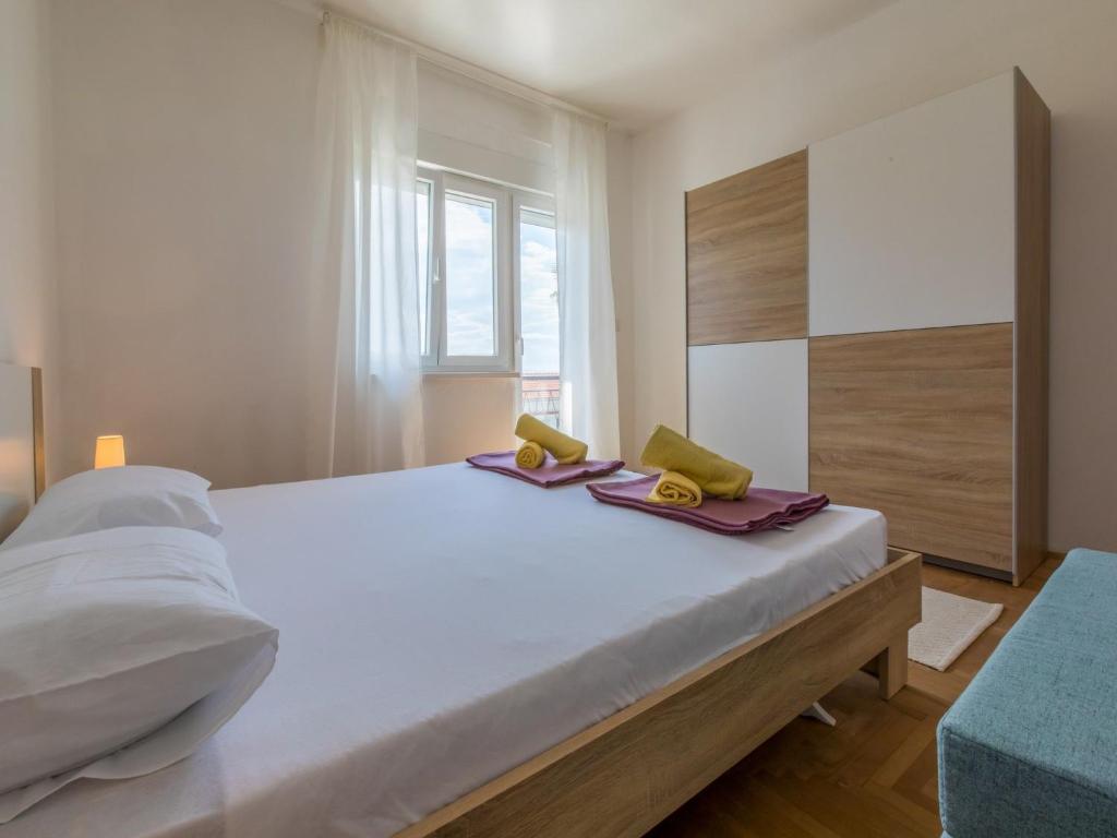 Postel nebo postele na pokoji v ubytování Apartments Alenka