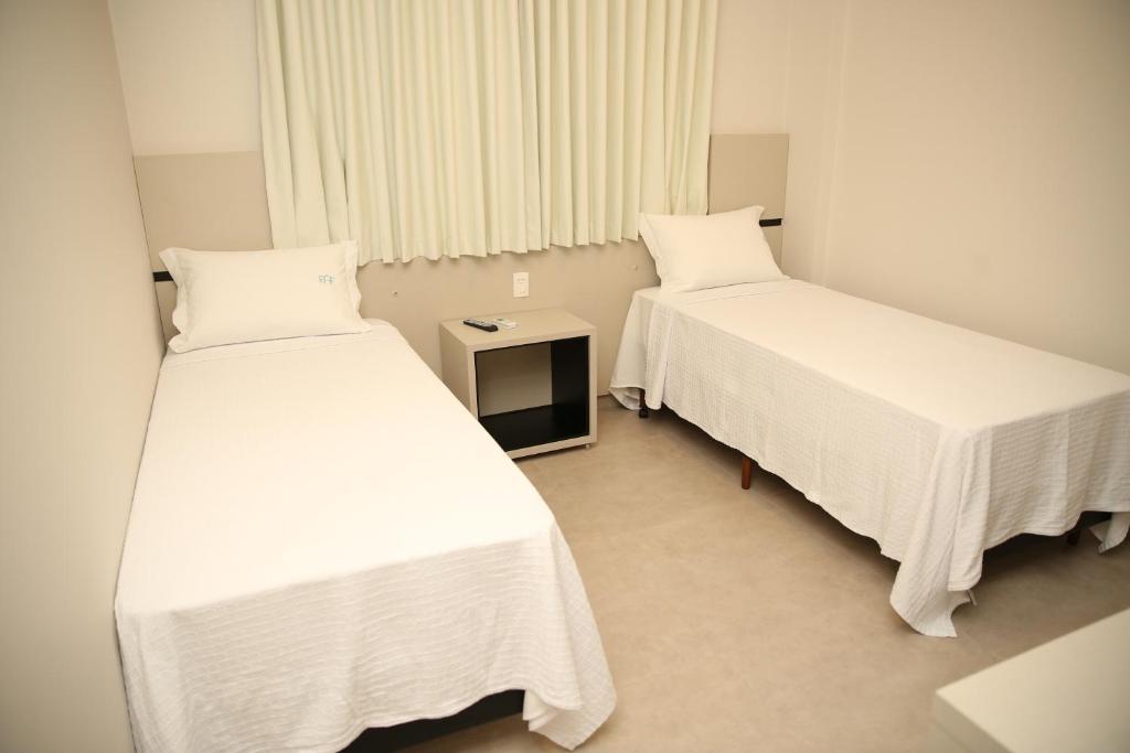 Postel nebo postele na pokoji v ubytování Raf Hotel