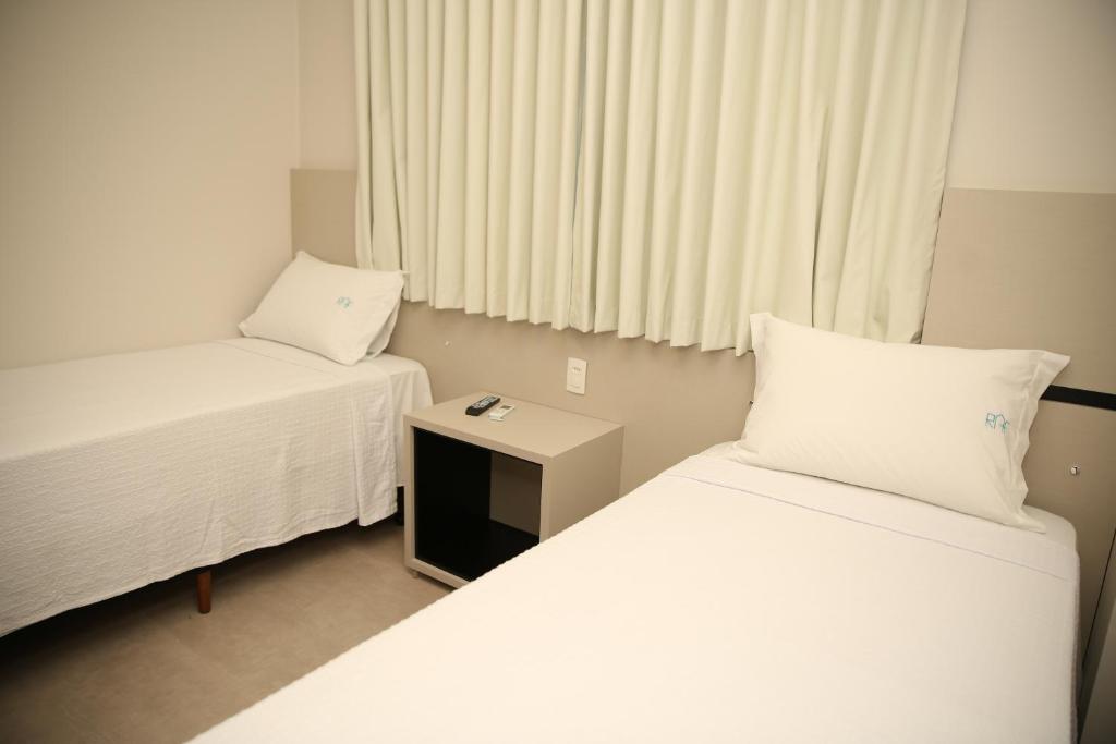 Postel nebo postele na pokoji v ubytování Raf Hotel