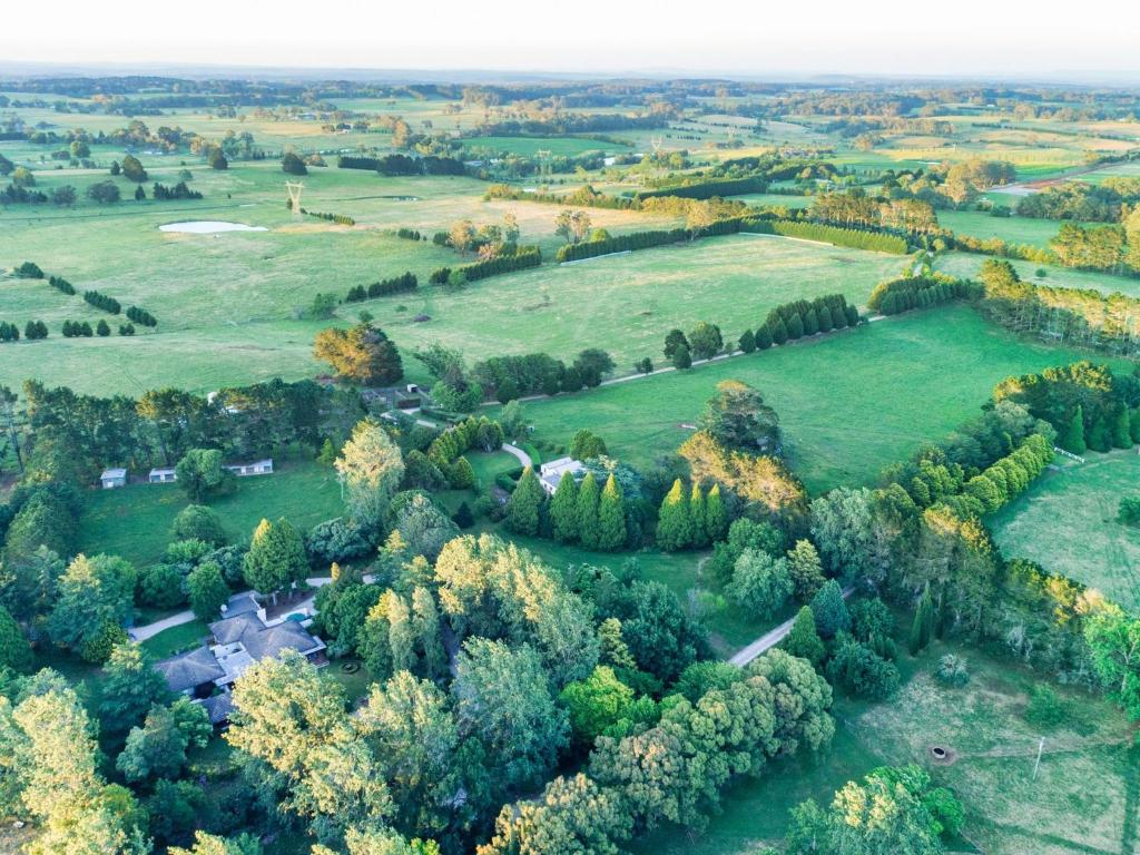 an aerial view of a field with trees at Normandie Park Exeter in Exeter