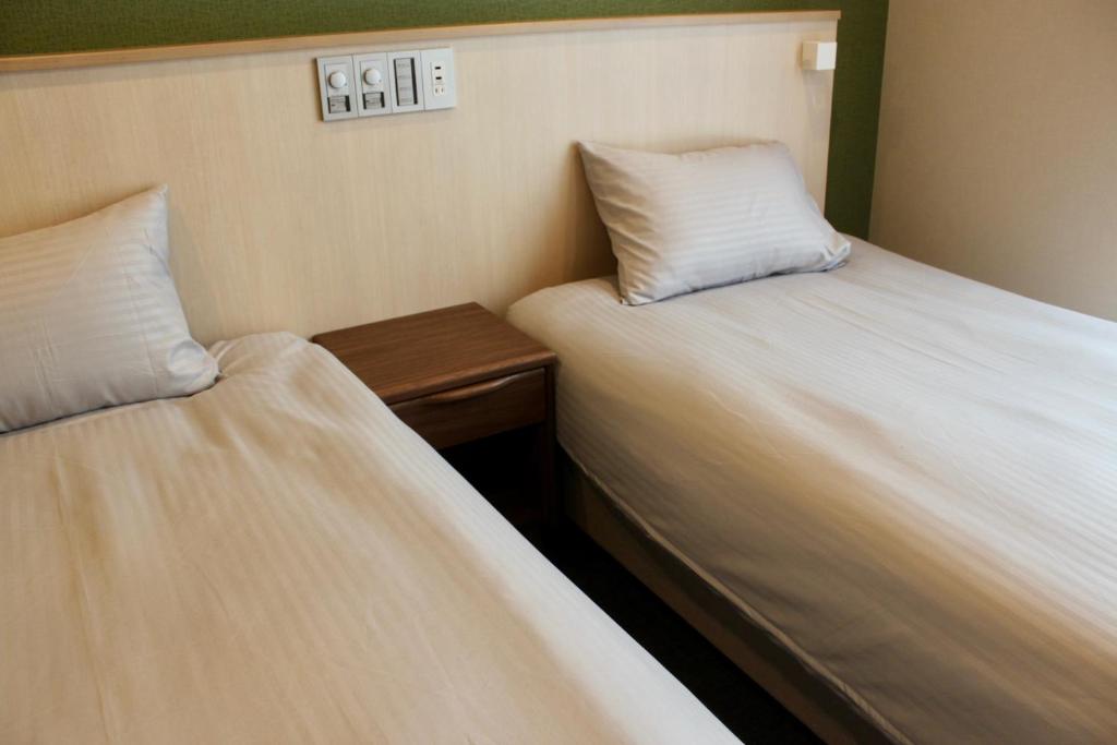 Postel nebo postele na pokoji v ubytování HIZ HOTEL Gion-Shirakawa