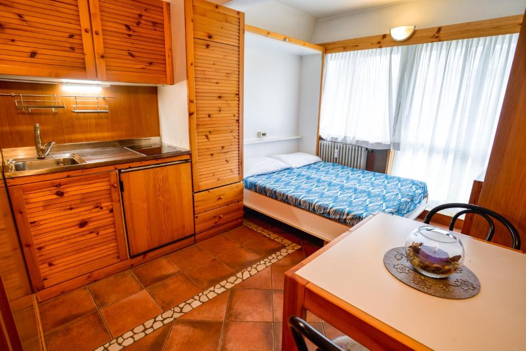 Postel nebo postele na pokoji v ubytování Residence Artuik Appartamenti Solandra
