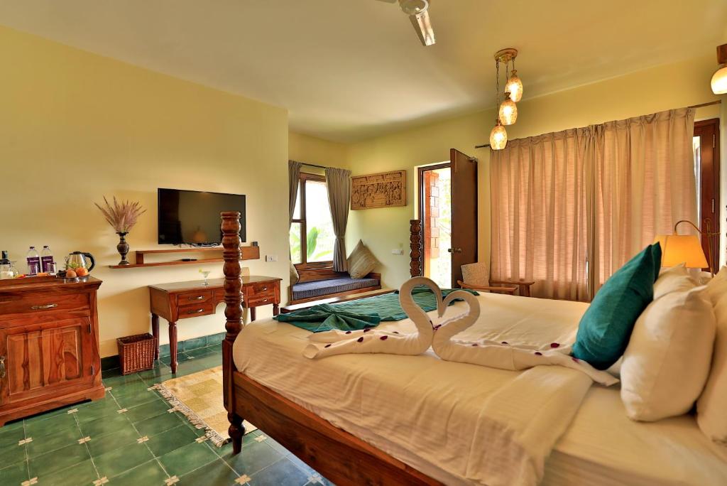 TV a/nebo společenská místnost v ubytování Heritage Resort Coorg