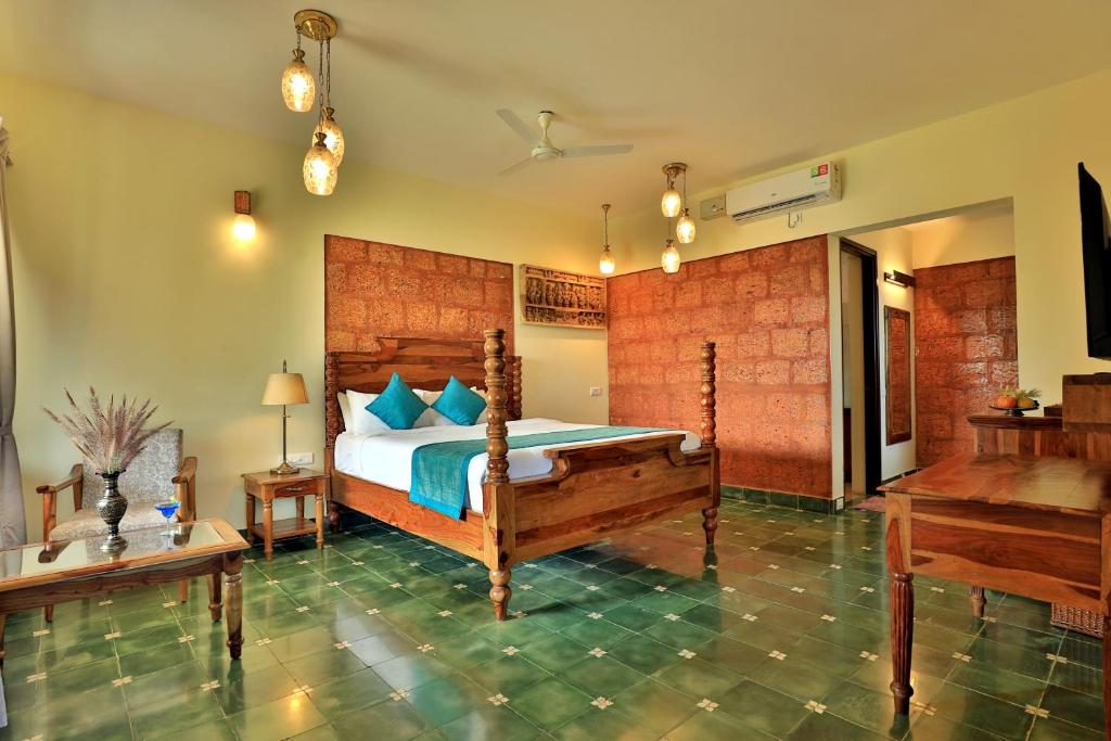 Postel nebo postele na pokoji v ubytování Heritage Resort Coorg
