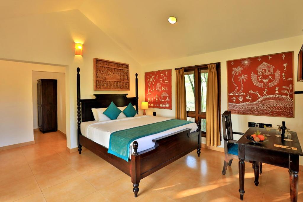 Postel nebo postele na pokoji v ubytování Heritage Resort Coorg