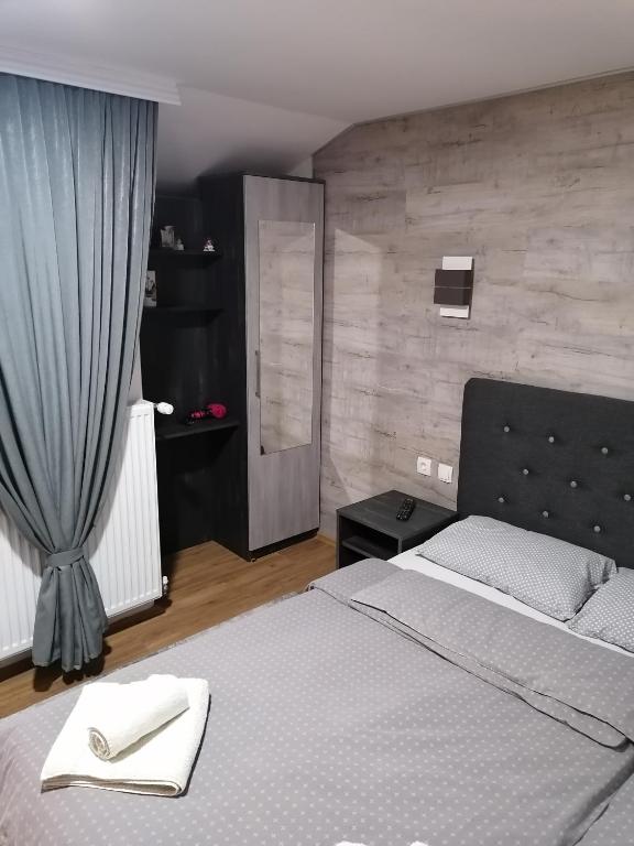 Postel nebo postele na pokoji v ubytování Prenoćište Day Holiday