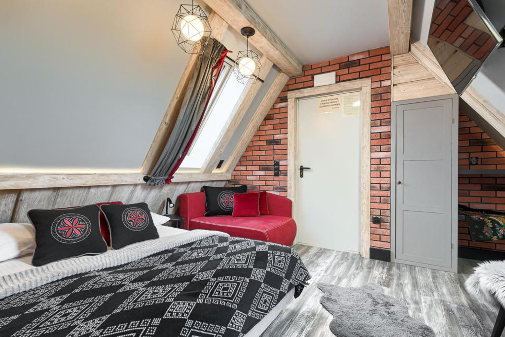 Posteľ alebo postele v izbe v ubytovaní Przytulia Apartamenty i Pokoje