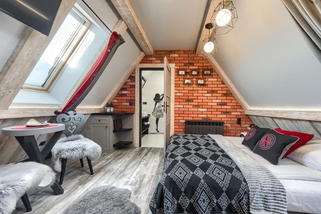 Posteľ alebo postele v izbe v ubytovaní Przytulia Apartamenty i Pokoje
