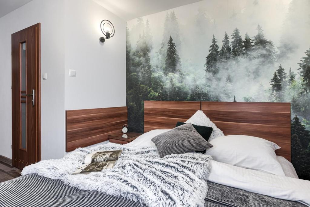 Posteľ alebo postele v izbe v ubytovaní Przytulia Apartamenty i Pokoje