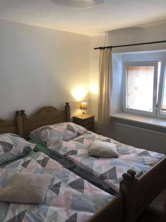 Postel nebo postele na pokoji v ubytování Penzion Na Růžku