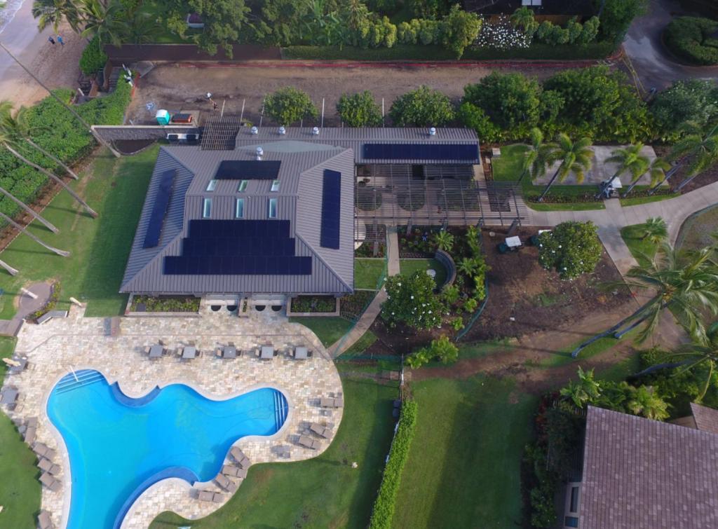 an aerial view of a house with a swimming pool at 9B EKAHI VILLAGE-STUDIO BATH, GARDEN VIEW - 1 MINUTE STROLL to BEACH! in Wailea