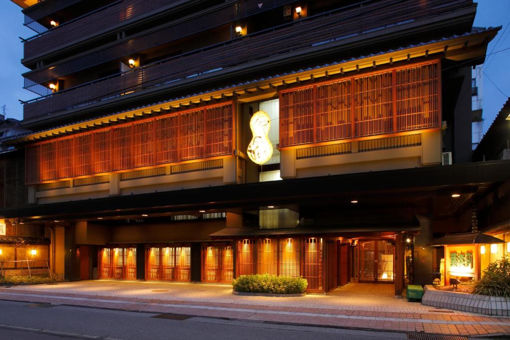 a building with a clock on the side of it at Hatori in Kaga