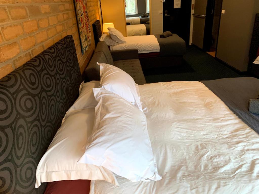 Кровать или кровати в номере Attunga Alpine Lodge & Apartments