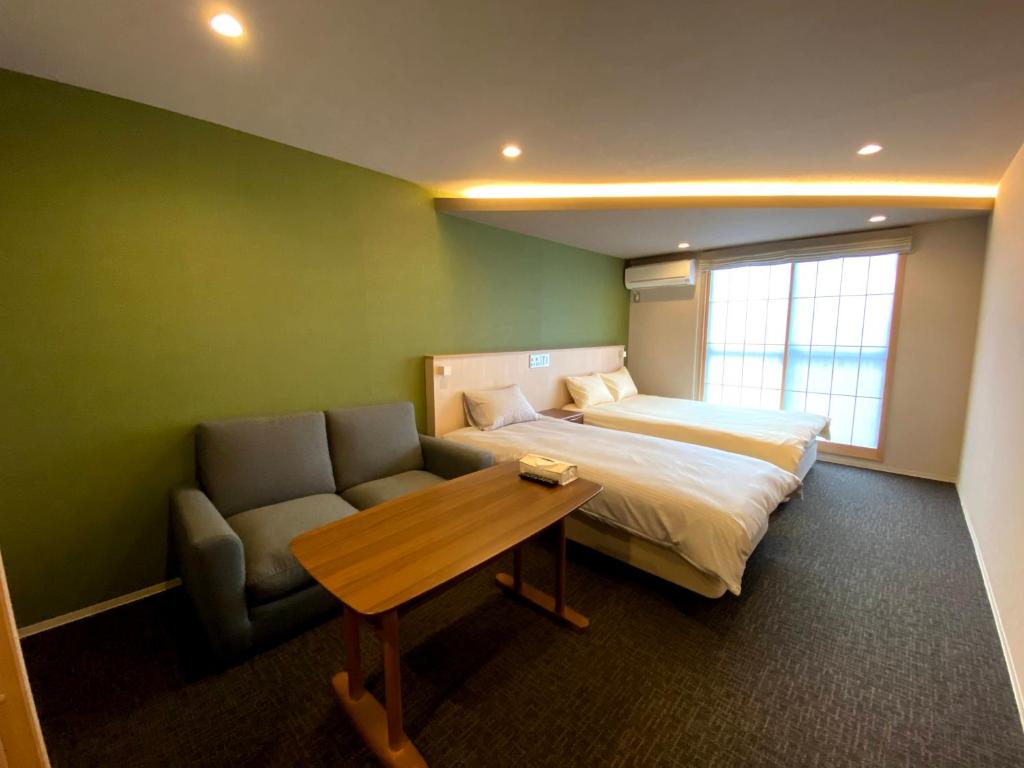 Postel nebo postele na pokoji v ubytování HIZ HOTEL Gion-Shirakawa