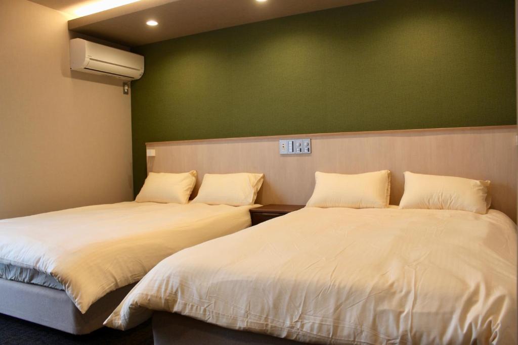 Postel nebo postele na pokoji v ubytování HIZ HOTEL Gion-Shirakawa