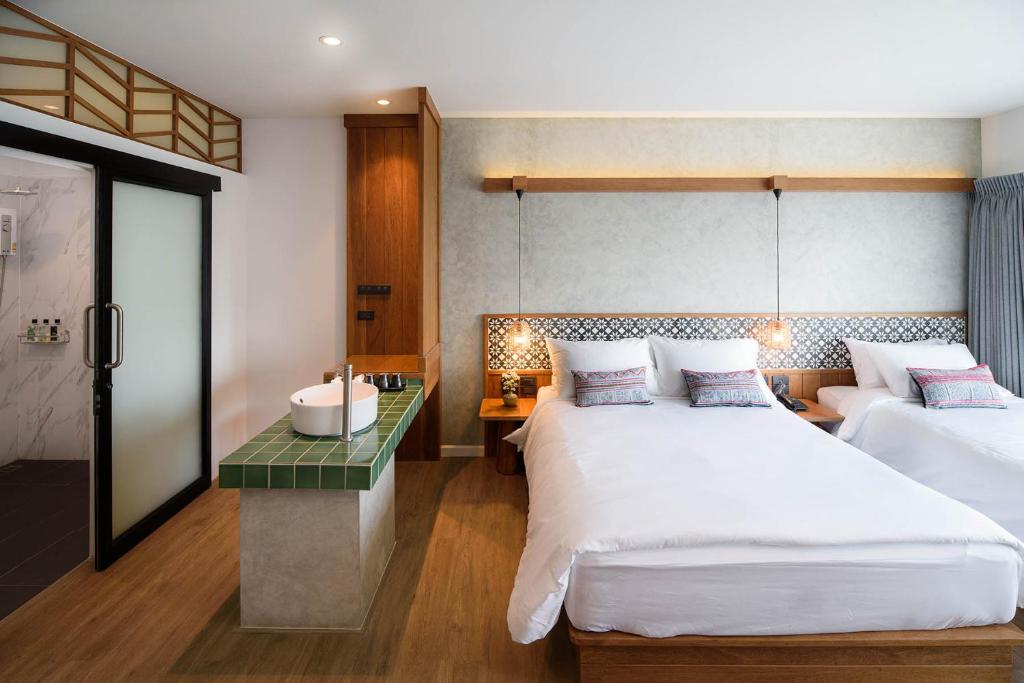 Кровать или кровати в номере Himku Hotel - adult only