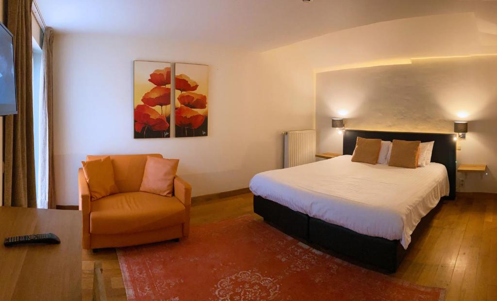 Postel nebo postele na pokoji v ubytování Hotel Côté Cour