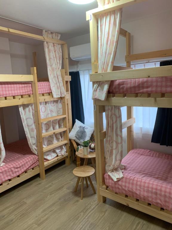 Postel nebo postele na pokoji v ubytování GUEST HOUSE TOKAI nagaragawa