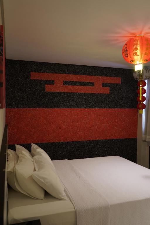 Postel nebo postele na pokoji v ubytování Pak Suítes Hotel