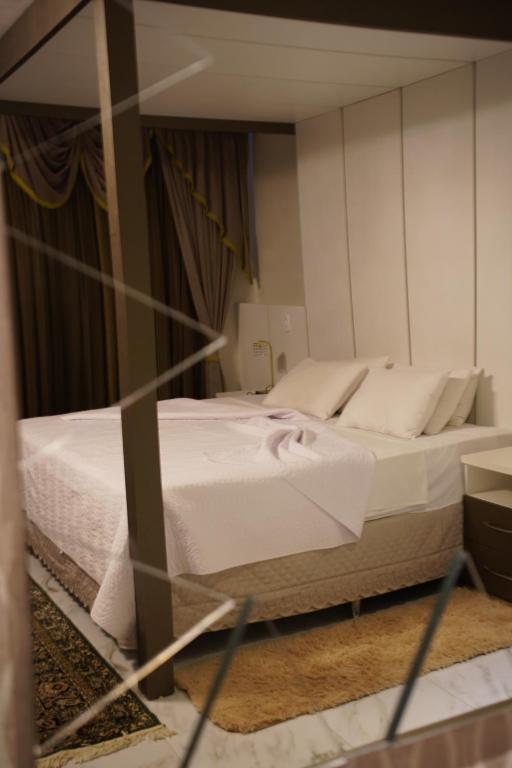 Postel nebo postele na pokoji v ubytování Pak Suítes Hotel
