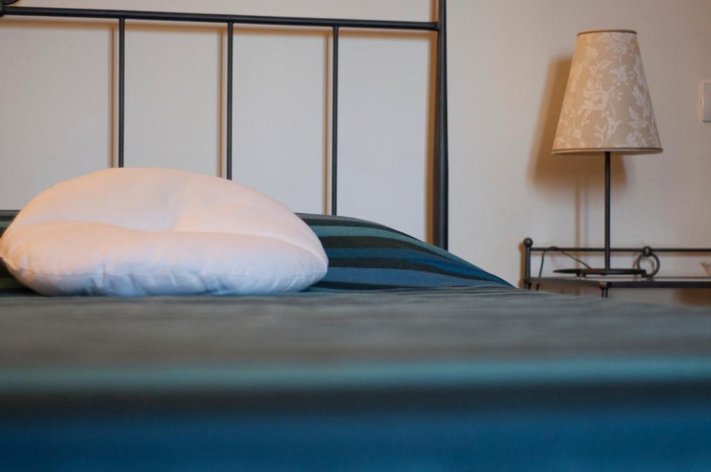 Postel nebo postele na pokoji v ubytování B&B Corte Barocca