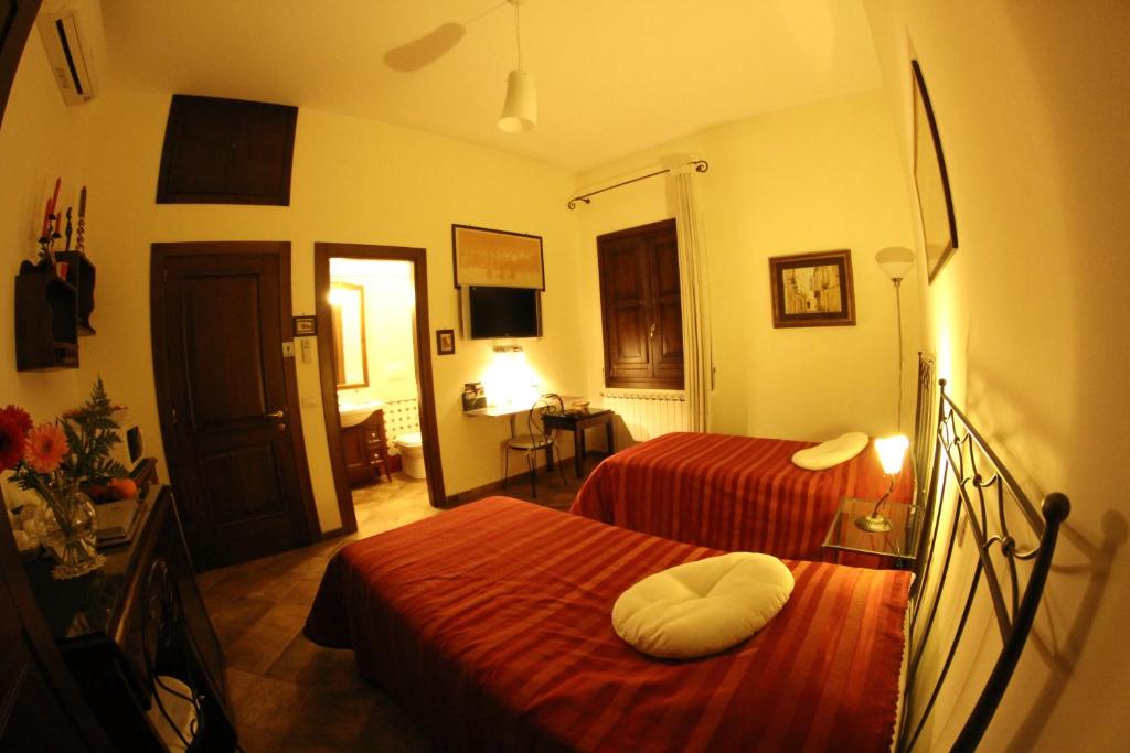 Postel nebo postele na pokoji v ubytování B&B Corte Barocca
