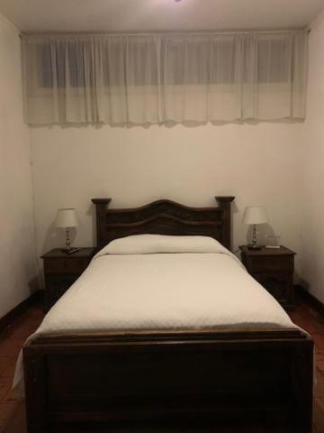 Hotel 1915 INN & SUITESにあるベッド