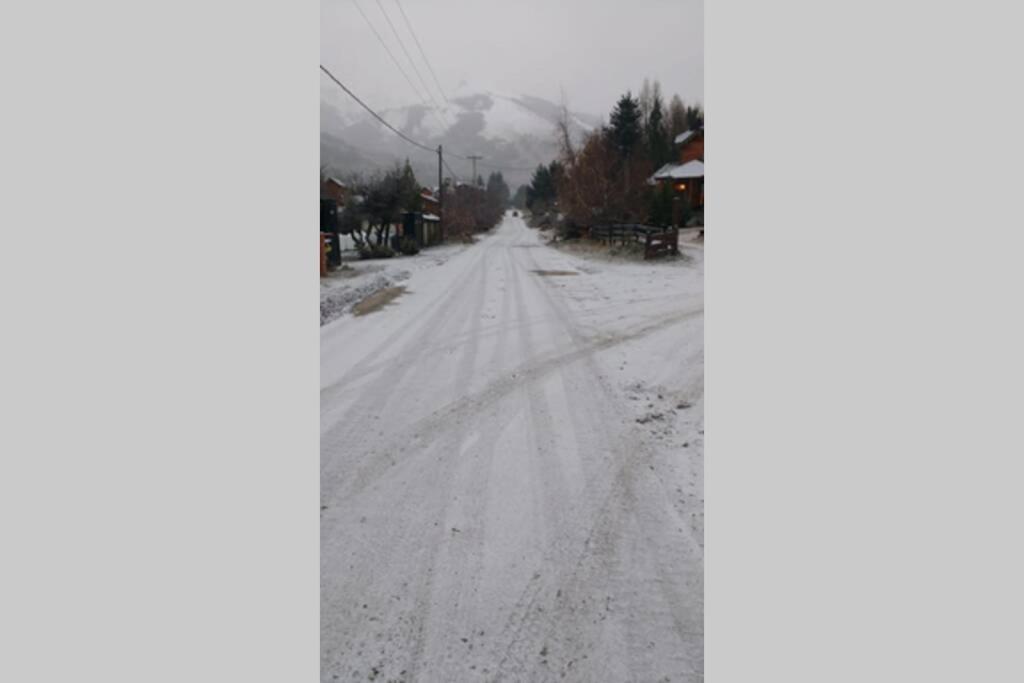 an empty road with snow on the ground at Schuss Cerro Catedral ARG41 in San Carlos de Bariloche