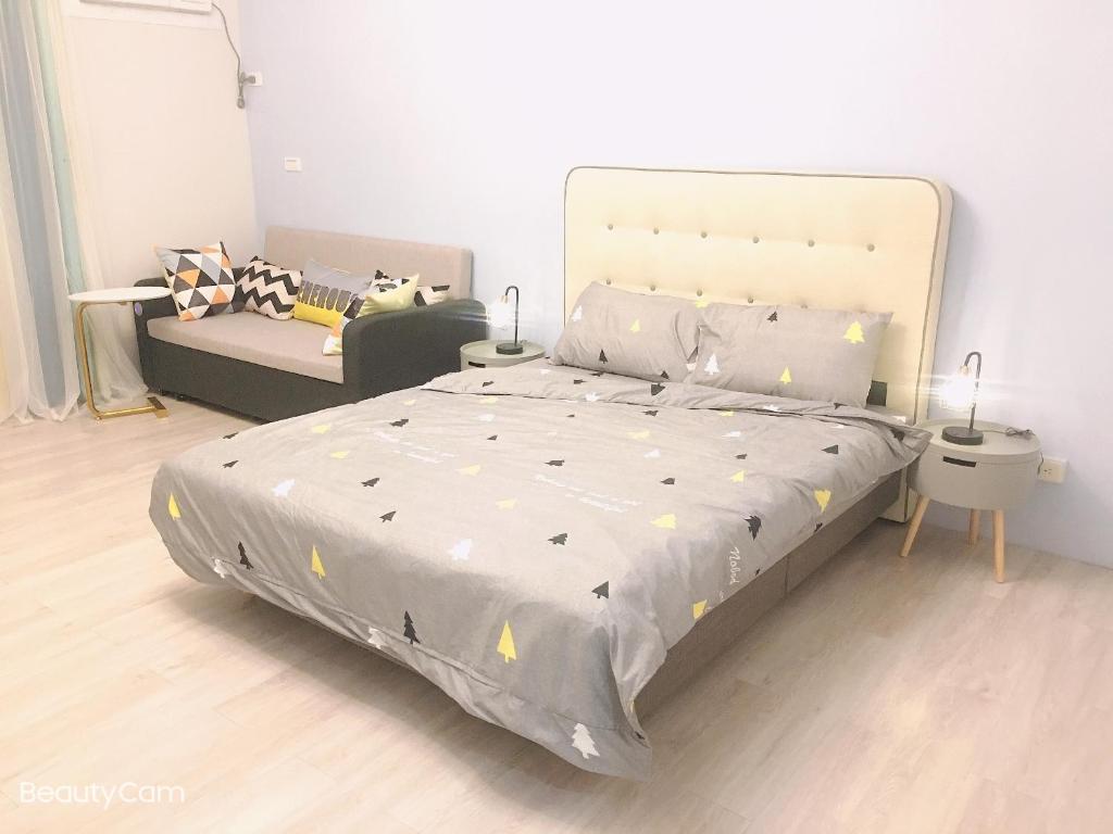 Postel nebo postele na pokoji v ubytování ㄧ個背包客棧