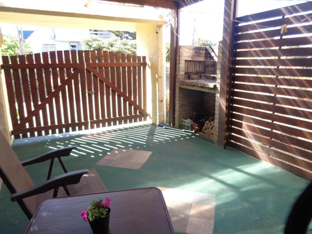 a patio with a table and chairs on a deck at Francais in La Paloma