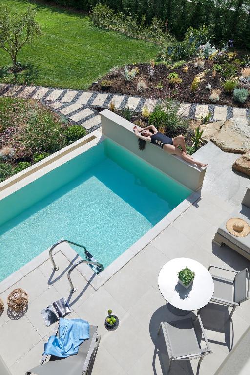 The swimming pool at or close to Cavo Delea Villas & Suites