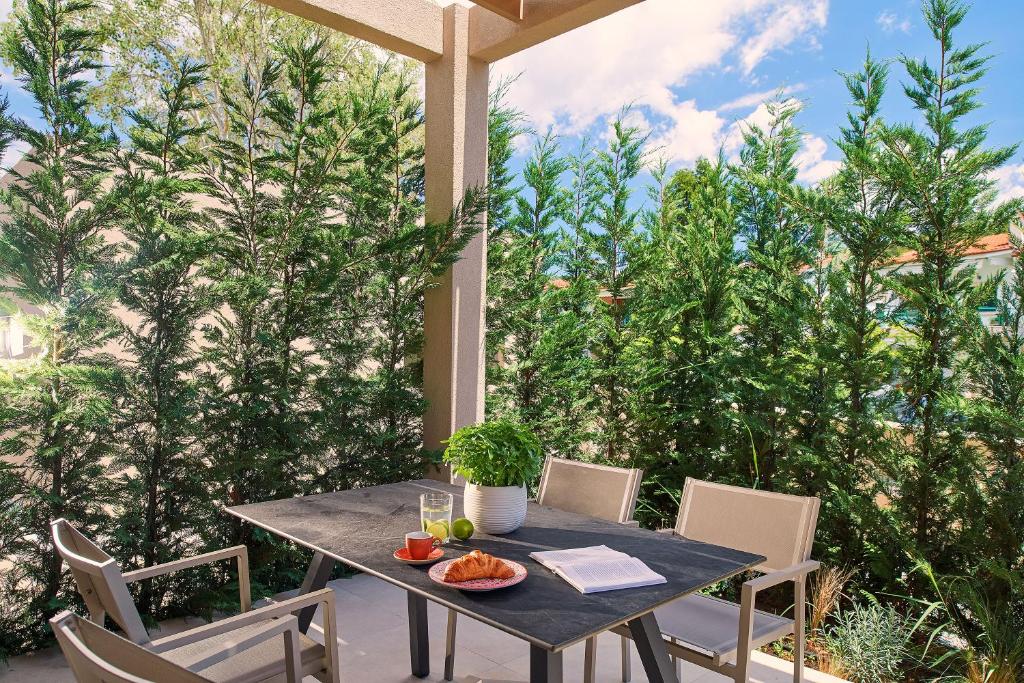 A garden outside Cavo Delea Villas & Suites