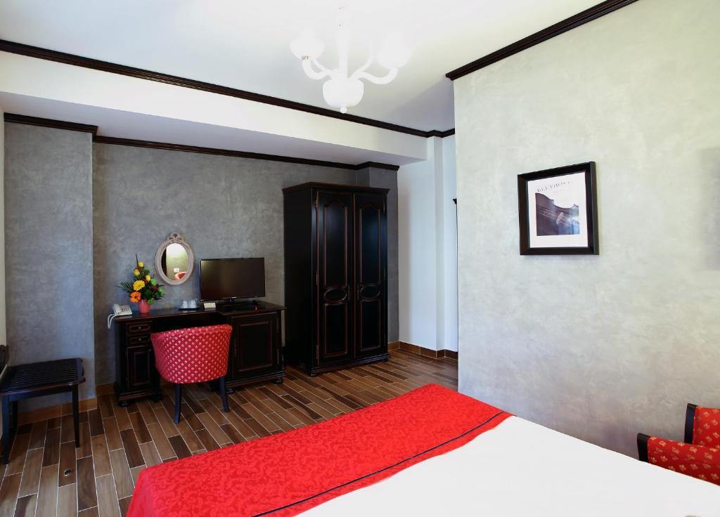 Postel nebo postele na pokoji v ubytování Hotel Galany