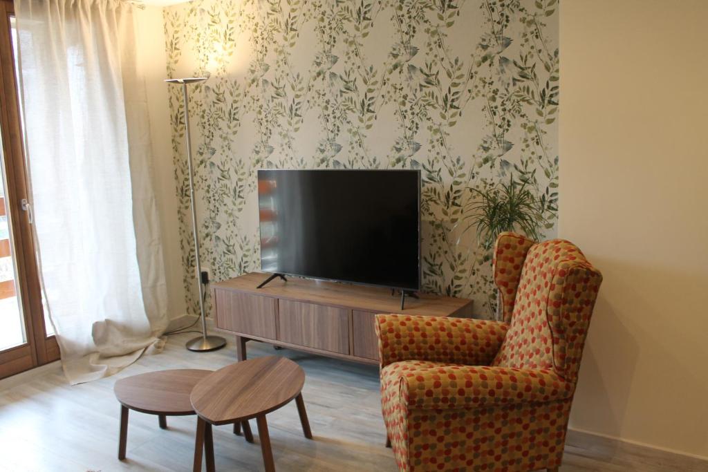 TV a/nebo společenská místnost v ubytování Hostal Casa Rosita