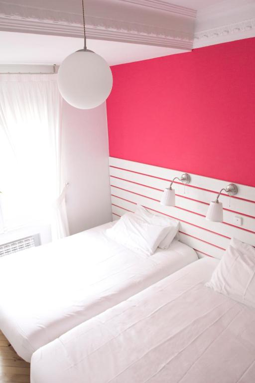 Posteľ alebo postele v izbe v ubytovaní Hostal Boreal Mistral