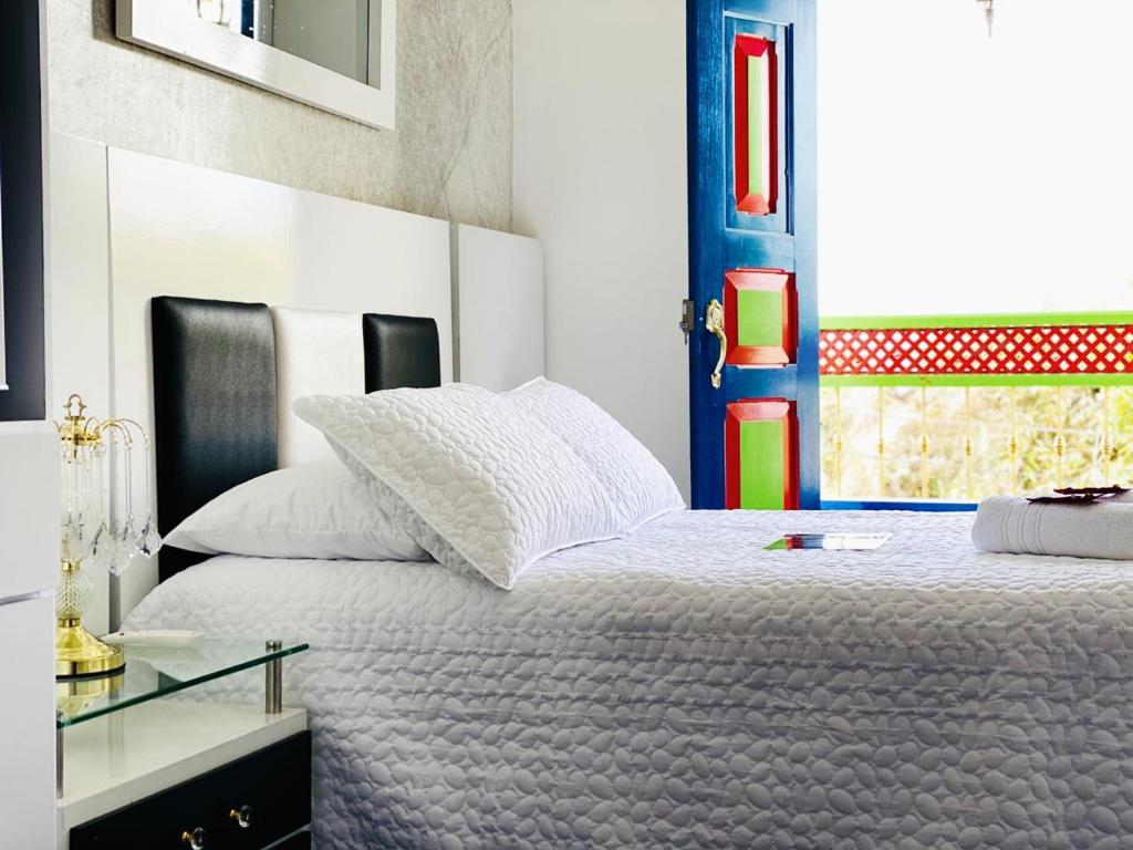Postel nebo postele na pokoji v ubytování CASABOUTIQUE HOTEL