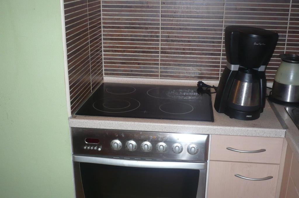Kuchyň nebo kuchyňský kout v ubytování Nia Családi Apartman