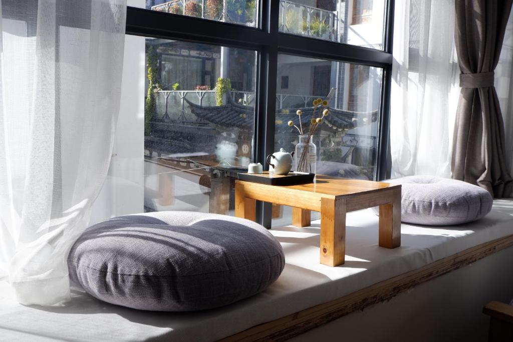 Postel nebo postele na pokoji v ubytování Dali Yunxi Boutique Inn
