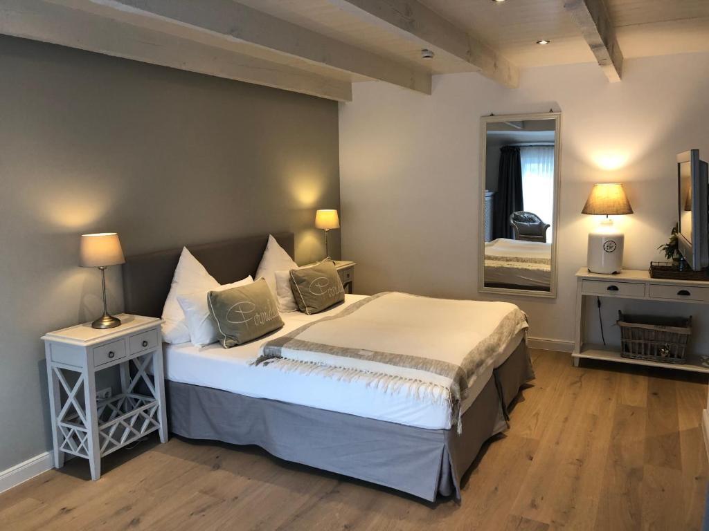Postel nebo postele na pokoji v ubytování Hotel Leegerpark