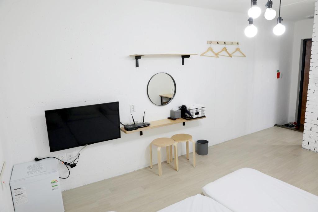 Postel nebo postele na pokoji v ubytování Minihotel Poongdaengi