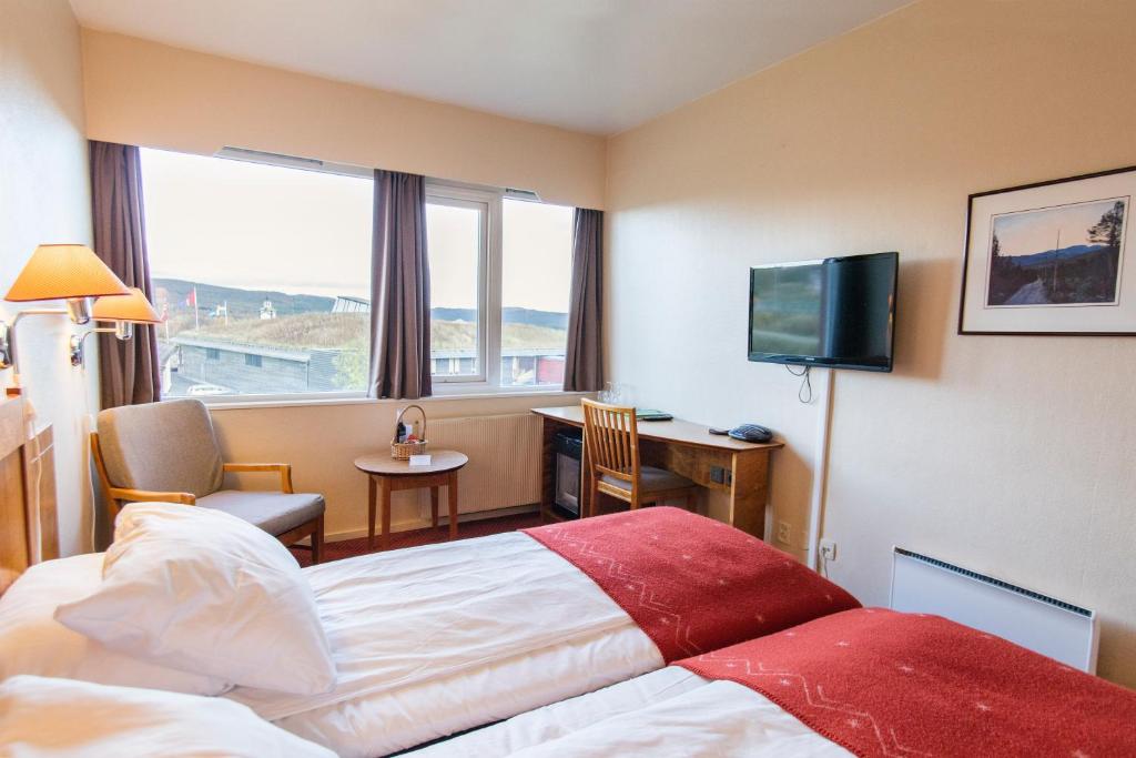 TV a/nebo společenská místnost v ubytování Røros Hotell - Bad & Velvære