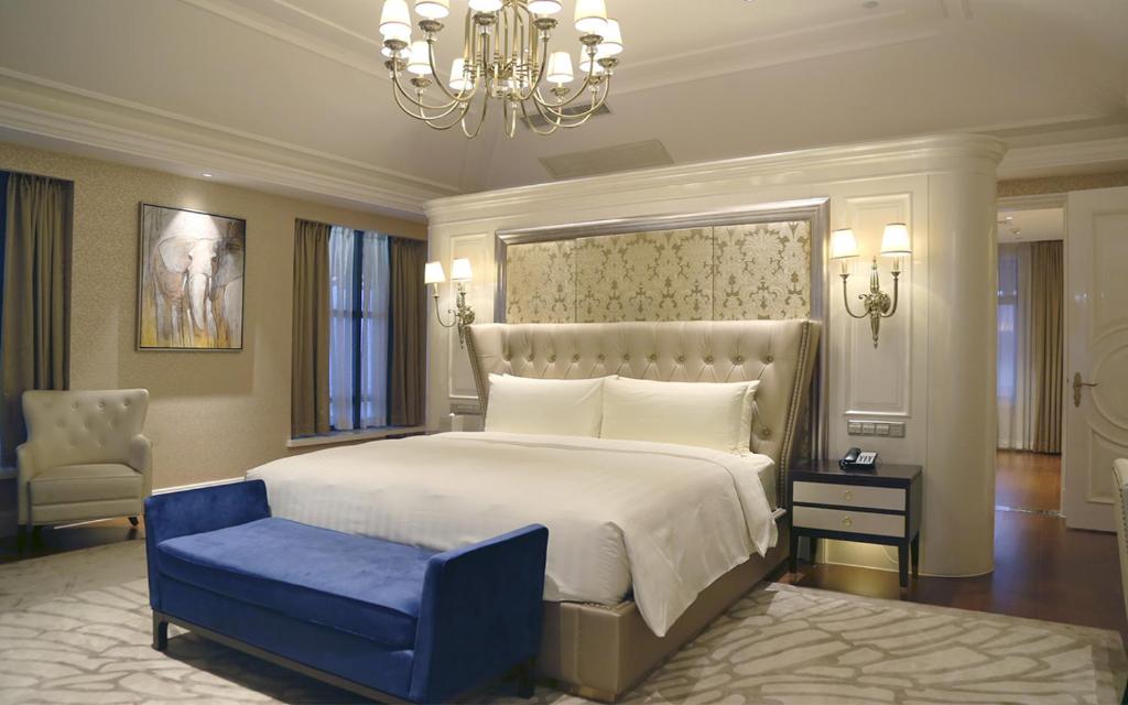 Postel nebo postele na pokoji v ubytování Wyndham Grand Xi'an Residence