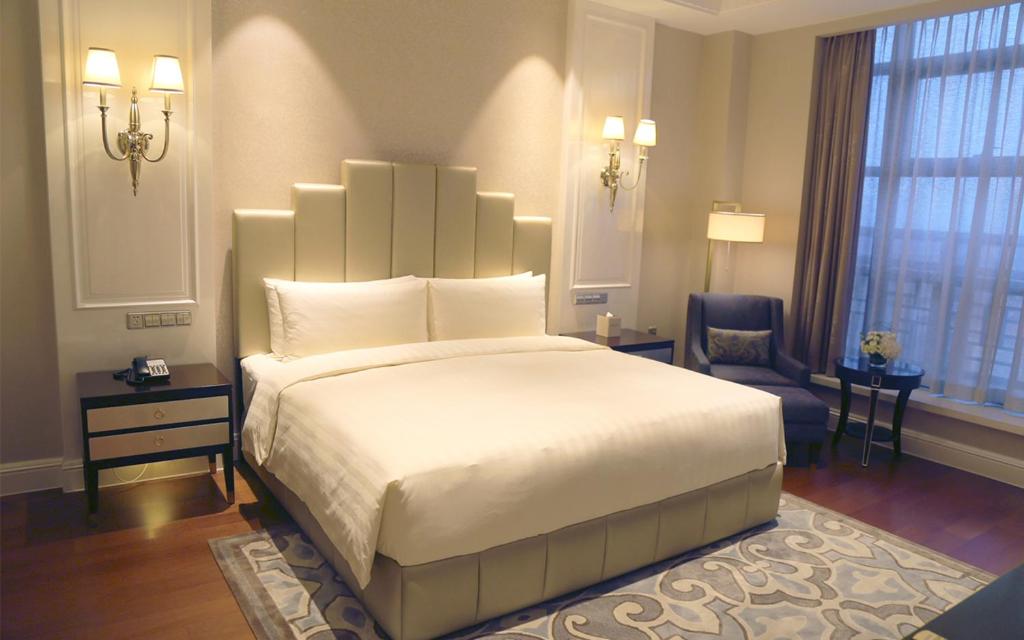 Postel nebo postele na pokoji v ubytování Wyndham Grand Xi'an Residence
