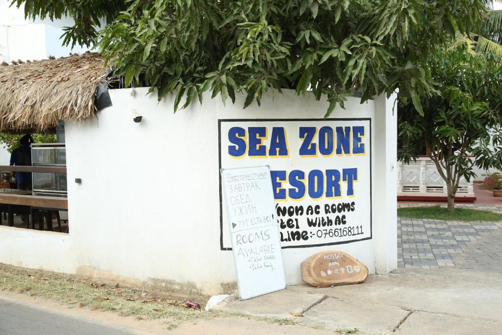 a sign for a sea zone event on a wall at Sea Zone Resort in Mirissa