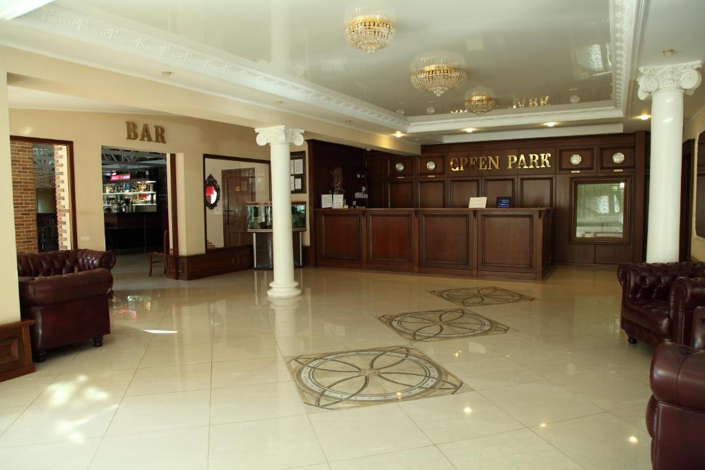 a lobby with a bar and a louis at Green Park in Domodedovo