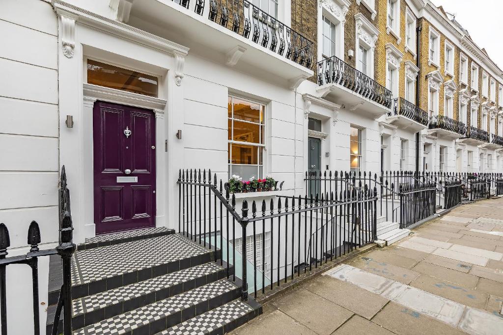 a purple door on the side of a building at Central London House Zone 1 in London