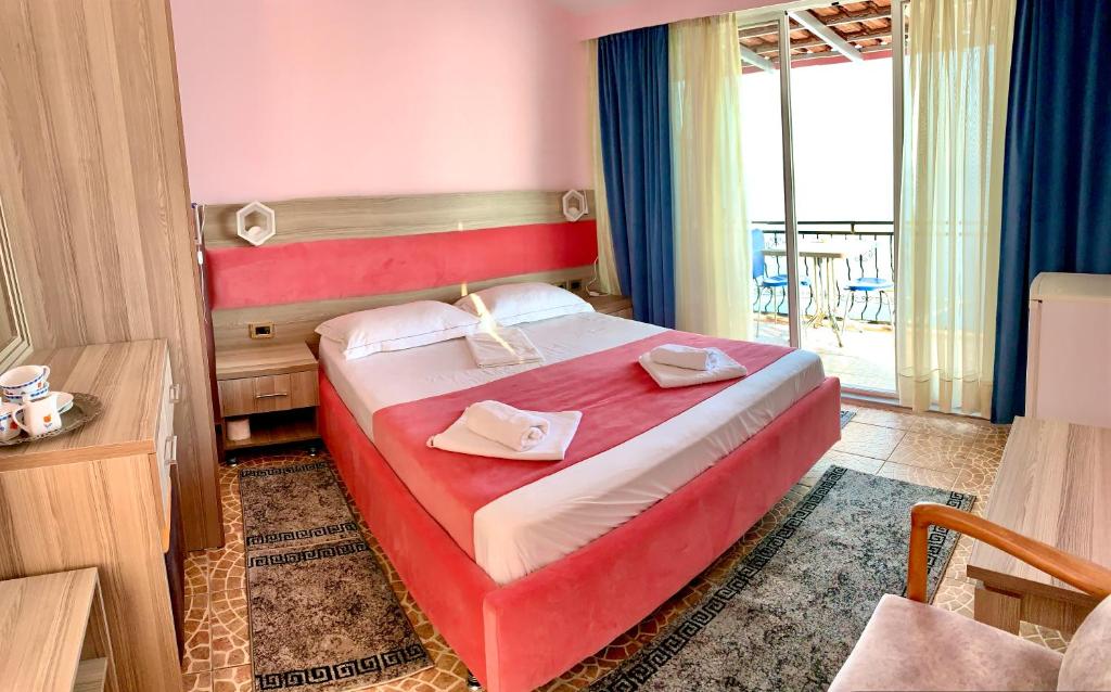 Postel nebo postele na pokoji v ubytování Hotel Odhisea Qeparo
