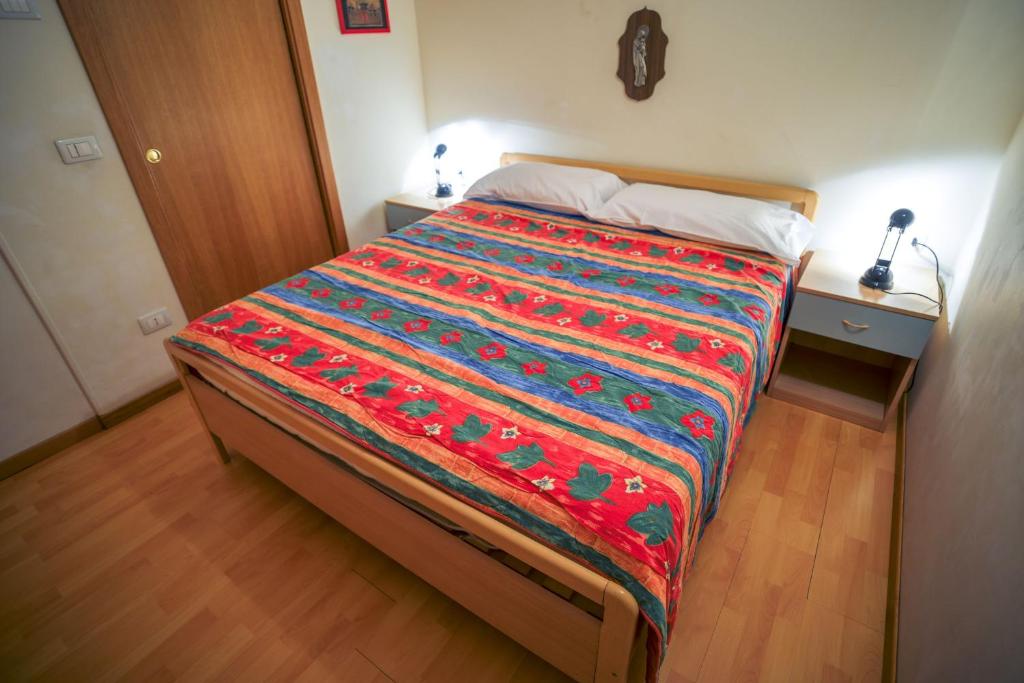 Postel nebo postele na pokoji v ubytování Res.Albarè/Solaria Apt.Solandra