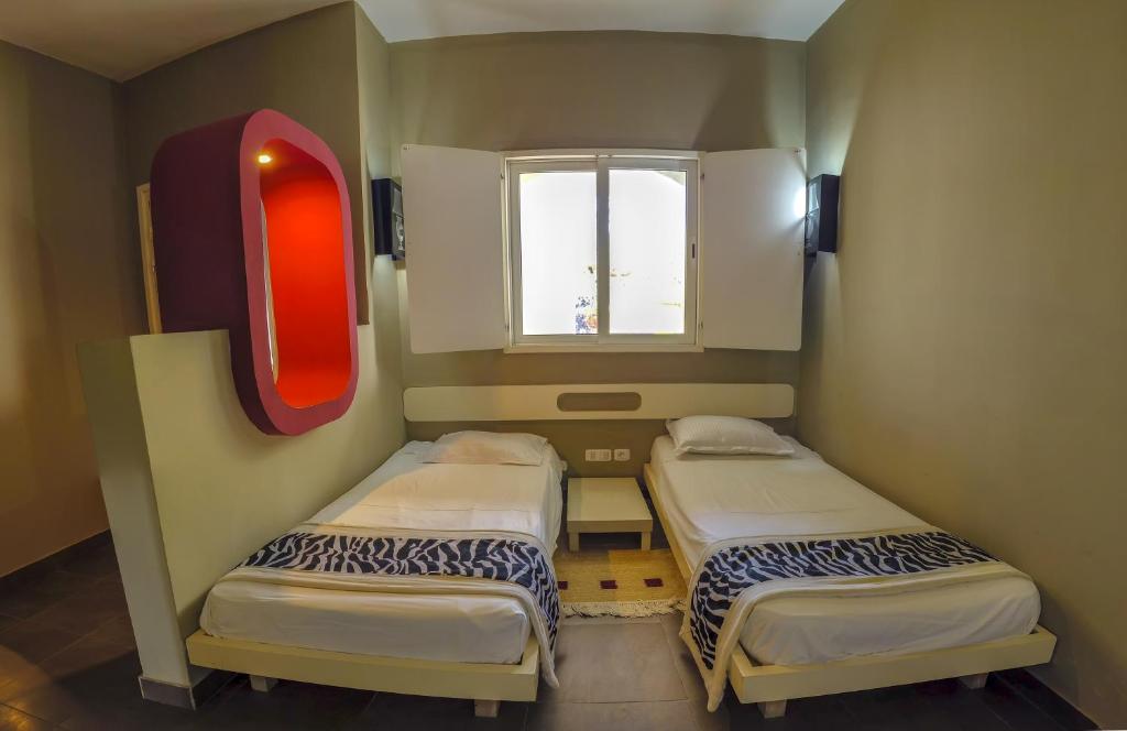 Postel nebo postele na pokoji v ubytování Fiesta Beach Djerba